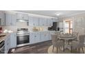 Eat-in kitchen features updated appliances, stylish countertops, and modern cabinetry at 111 Mcdole Cir, Cary, NC 27511