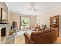 Comfortable living room with natural light, fireplace, and plush armchairs at 119 Danforth Dr, Cary, NC 27511