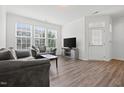 Bright living room with lots of natural light and hard surface floors for a contemporary look at 1728 Shady Oaks Dr, Wendell, NC 27591