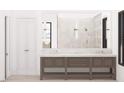 Elegant bathroom featuring double vanity with stone countertop, large mirrors, walk-in glass shower, and neutral tile at 1808 Stream Manor Ct, Wake Forest, NC 27587