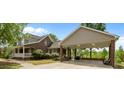 Exterior view highlights a brick house with a covered parking area and a covered porch, perfect for outdoor living at 1852 Gwyn Rd, Burlington, NC 27217