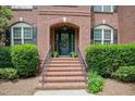 Elegant brick front steps lead to a charming front door with an arched brick entryway at 225 Norwalk St, Holly Springs, NC 27540