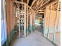 Unfinished home interior featuring exposed framework, open space, a window, and framed doorways ready for customization at 243 Steel Springs Ln # 25, Angier, NC 27501
