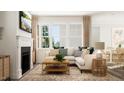 Elegant living room featuring a fireplace, large windows, comfortable seating, and chic decor, creating a warm and inviting atmosphere at 2924 Ocean Sunrise Dr, Wake Forest, NC 27587