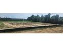 Future home construction site featuring a clear view of the lot, foundation work, and utilities installed at 37 Matthew Meadow Ln, Lillington, NC 27546