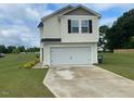Charming two-story home featuring a spacious two-car garage and a paved driveway at 4097 Cordiality Church Rd, Nashville, NC 27856