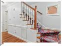 Elegant staircase featuring classic wood banister and decorative carpet runner at 45 Birnham Ln, Durham, NC 27707