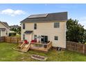 Backyard view featuring a deck perfect for entertaining and relaxing in a well-maintained yard at 76 Haywood St, Spring Lake, NC 28390