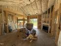 This future living room has fireplace, high ceilings, and light filled window ready for finishing touches at 82 Laramie Ln, Selma, NC 27576