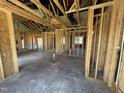 Spacious living room under construction, featuring exposed framing, marked electrical spots, and room for personalization at 82 Laramie Ln, Selma, NC 27576