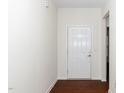 Bright entryway featuring hardwood floors, a white front door, and neutral walls for a welcoming ambiance at 826 Downfield Ln, Fuquay Varina, NC 27526