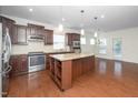 Open kitchen design with stainless steel appliances, granite countertops, and a spacious island at 826 Downfield Ln, Fuquay Varina, NC 27526