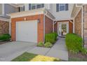 Welcoming home exterior features a brick facade and well-maintained front yard landscaping at 8404 Saltwood Pl, Raleigh, NC 27617