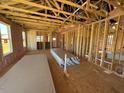 Spacious interior with exposed framing and insulation, awaiting final construction at 90 Brookhaven Dr, Spring Hope, NC 27882