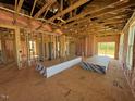 Open floor plan showcasing unfinished construction, offering a blank canvas for customization at 90 Brookhaven Dr, Spring Hope, NC 27882