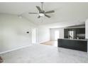Inviting living room with ceiling fan, and an open flow to the kitchen, perfect for entertaining at 103 Hampshire Pl, Kenly, NC 27542