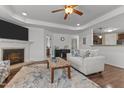 Bright living room featuring a fireplace, neutral furniture, and modern decor at 106 Lockwood Dr, Cameron, NC 28326