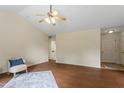 Bright living room showcasing hardwood floors, a ceiling fan, and neutral paint colors at 118 Setter Pt, Clayton, NC 27520