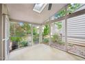 Bright screened porch with views of the yard from all angles, and ceiling skylight at 124 Twin Oaks Pl, Cary, NC 27511