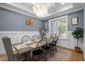 Stylish dining room with a rustic wood table, modern chairs, and elegant decor at 147 Gentry Dr, Pittsboro, NC 27312