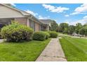 Brick ranch home with manicured bushes and inviting sidewalk at 2423 Northern Bnd, Burlington, NC 27217