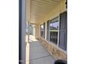 Covered porch with stone accents, offering a glimpse of the home's exterior at 2511 Dalmahoy Ln, Fuquay Varina, NC 27526