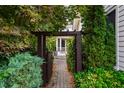 Charming walkway and lush landscaping leading to the front door and porch at 253 Tobacco Farm Way, Chapel Hill, NC 27516