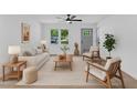 Bright living room with modern furnishings, neutral tones, and ample natural light at 460 Bunn Elementary School Rd, Bunn, NC 27508