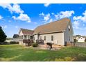 A house with a cozy backyard with a wooden fence, deck, and grill at 479 Manchester Trail, Clayton, NC 27527