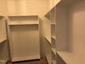 Walk in closet with open shelving providing ample storage space for organizing your wardrobe at 55 Leah Ln, Louisburg, NC 27549