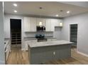 Bright kitchen with stainless steel appliances, granite countertops, and a large center island at 55 Leah Ln, Louisburg, NC 27549