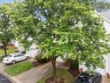 Overhead view of townhouses, showcasing their well-maintained lawns and convenient parking areas at 5506 Cottonrose Ln, Raleigh, NC 27606