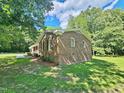 Lovely single story brick home surrounded by mature trees and landscaping at 5614 Skyline Dr, Durham, NC 27712