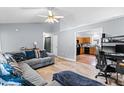 Open-concept living room showcasing wood floors and seamless flow to the kitchen at 601 Southampton Dr, Knightdale, NC 27545