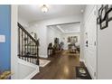 Open foyer with hardwood floors and staircase, leading to a bright living space at 6521 Sunset Manor Dr, Wake Forest, NC 27587