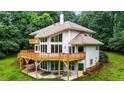 Well maintained home with large deck, surrounded by lush greenery at 7918 Dairy Ridge Rd, Mebane, NC 27302