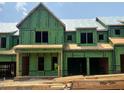 New construction featuring house wrap and wood framework, showcasing the early building stages at 1013 Coldspring Circle, Durham, NC 27705