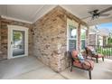 Relaxing front porch with stone accents, comfortable seating, and views of the surrounding landscape at 125 Greenway Landing Lndg, Chapel Hill, NC 27516