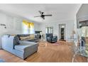 Spacious living room with hardwood floors, large windows, and modern decor at 144 Shawnee Dr, Louisburg, NC 27549