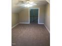 Neutral attic space with carpeting, a ceiling fan, and an open doorway to the hallway at 158 Presidents Dr, Durham, NC 27704