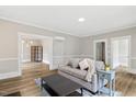 Bright living room with hardwood floors, neutral paint, and modern decor at 205 Forest Hill Ave, Rocky Mount, NC 27804