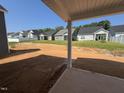 View of several houses in the community from the backyard with patio at 252 Meadowbark Bnd # 46, Garner, NC 27529