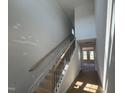 View of the hallway and staircase featuring wood railing and white walls at 252 Meadowbark Bnd # 46, Garner, NC 27529