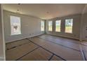 Spacious living room with three windows, awaiting customization at 252 Meadowbark Bnd # 46, Garner, NC 27529