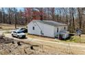 View of the back of the home featuring a small deck at 2778 Morton-Pulliam Rd, Roxboro, NC 27574