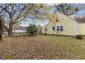 Spacious backyard featuring a partial fence and a lush lawn scattered with fallen leaves at 345 Henderson St, Oxford, NC 27565