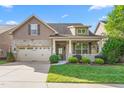 Beautiful two-story home featuring a well-kept lawn and an attached two-car garage at 4110 Argyle Trl, Burlington, NC 27215