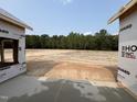 Shot of the backyard with a line of trees behind the lot at 455 Beacon Hill Rd # 28, Lillington, NC 27546