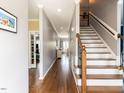 Inviting foyer with hardwood floors and staircase at 5009 Beckwyck Dr, Fuquay Varina, NC 27526
