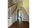 Inviting entryway with hardwood floors and staircase leading to the upper level at 509 W Rose St, Sanford, NC 27330